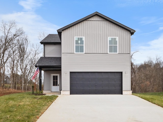 view of front of house featuring a garage and a front yard