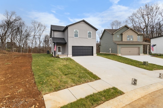 view of front of house featuring a garage and a front lawn