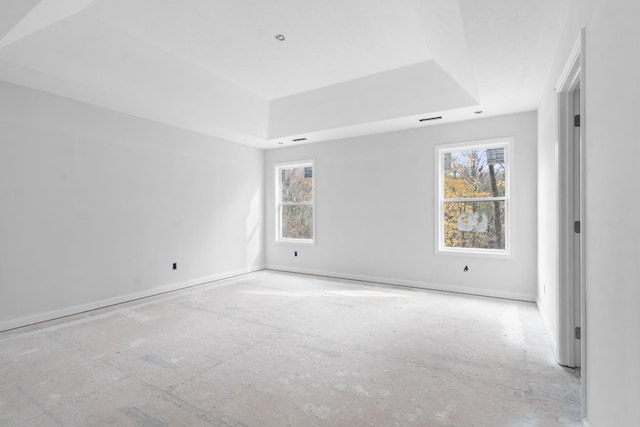 empty room featuring a tray ceiling