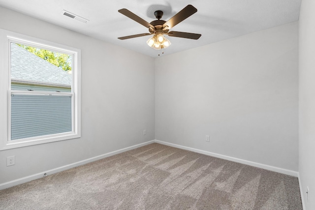 empty room with carpet floors and ceiling fan