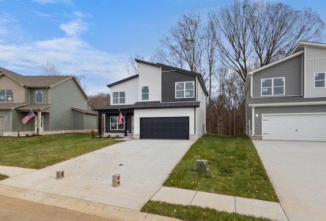 view of front of property featuring a garage and a front yard