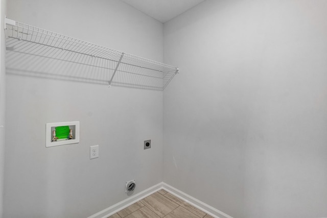 laundry room with hookup for an electric dryer and hookup for a washing machine