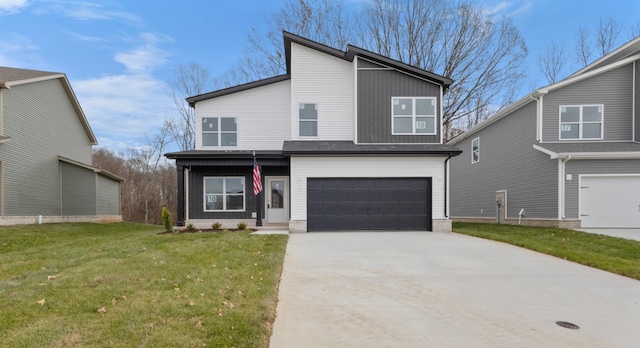 view of front of home featuring a garage and a front lawn