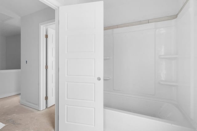 bathroom featuring shower / tub combination and concrete floors