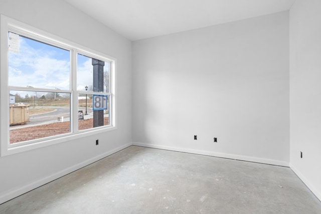 empty room featuring concrete flooring