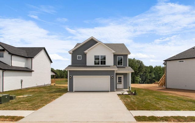 view of front of house featuring a garage and a front lawn