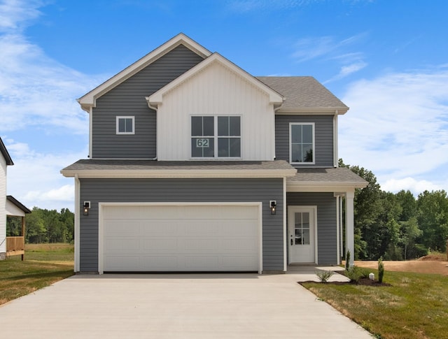 view of front of home featuring a garage and a front lawn