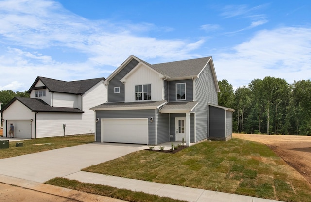 view of front facade with a garage and a front yard