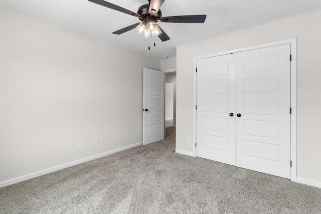 unfurnished bedroom with light colored carpet, a closet, and ceiling fan