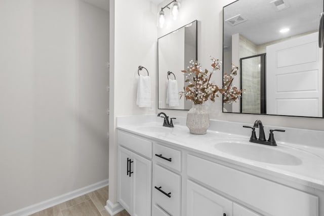 bathroom featuring vanity and walk in shower