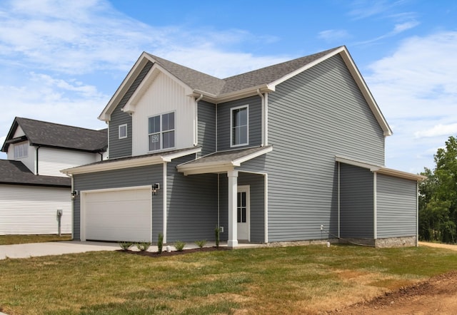 view of front facade with a garage and a front lawn