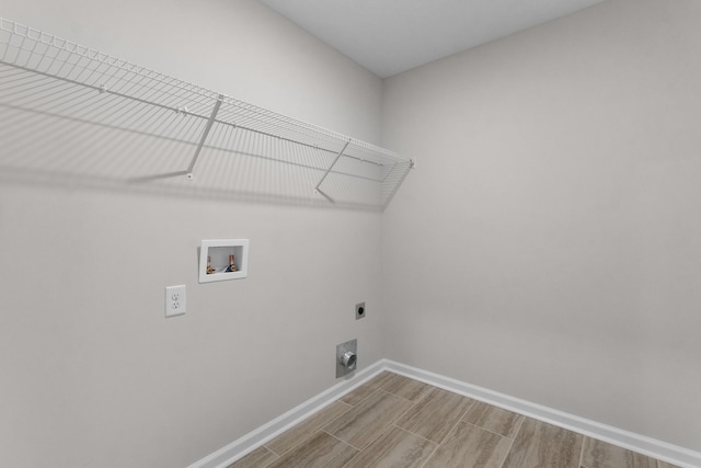 laundry area with hardwood / wood-style flooring, washer hookup, and hookup for an electric dryer