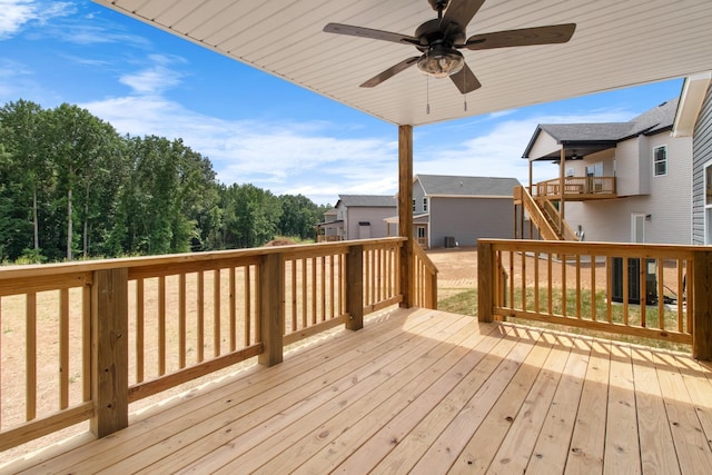 wooden deck featuring ceiling fan