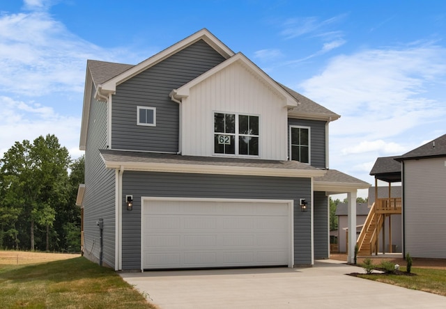 view of front property with a garage and a front yard