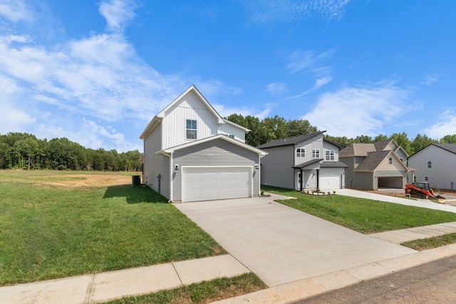 view of front of property with a garage and a front lawn