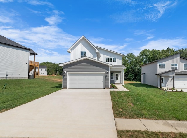 view of front of property featuring a garage and a front lawn