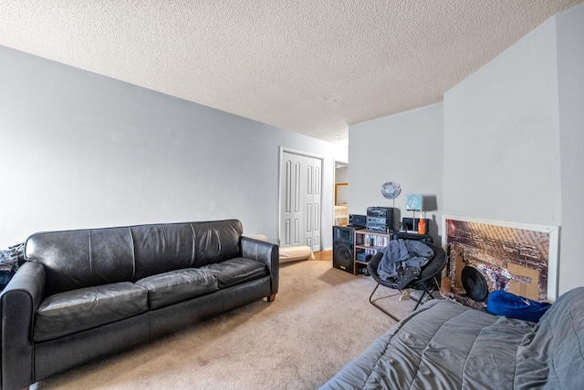 living room with a textured ceiling and carpet flooring