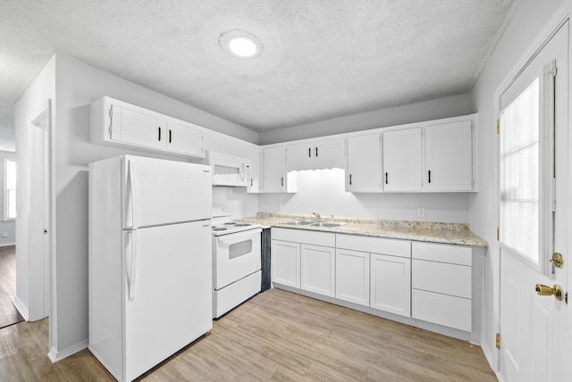 kitchen with white cabinetry, sink, light wood-type flooring, white appliances, and a textured ceiling