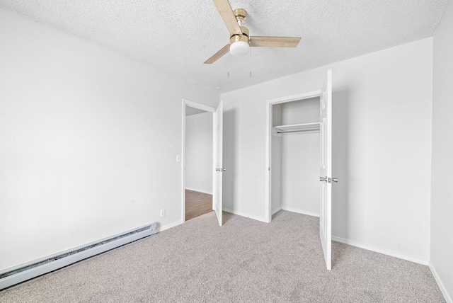 unfurnished bedroom with a baseboard radiator, ceiling fan, light carpet, a textured ceiling, and a closet