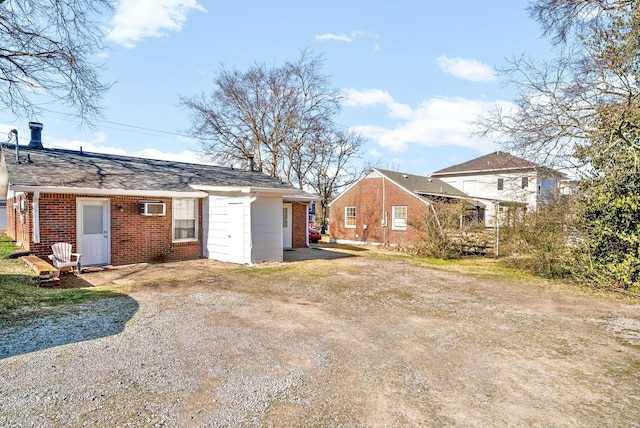 back of property with a wall mounted AC