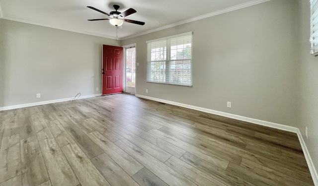 spare room with ornamental molding, light hardwood / wood-style floors, and ceiling fan