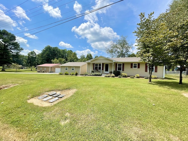 single story home with a garage, a porch, and a front yard