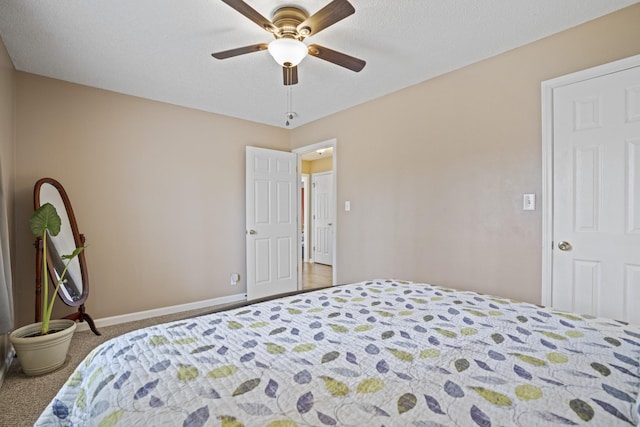 bedroom with a textured ceiling, ceiling fan, and carpet flooring