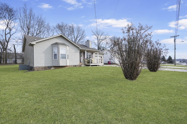 exterior space featuring a front yard and central air condition unit