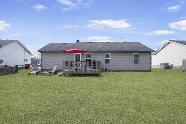 rear view of house with a yard, a deck, and central air condition unit