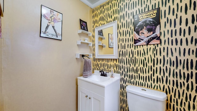 bathroom with vanity and toilet