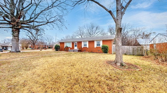 ranch-style home with a front lawn