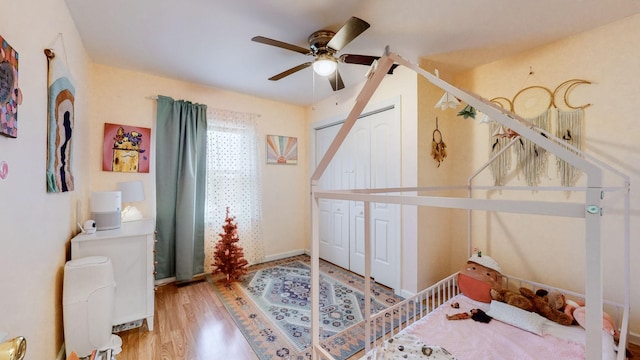 bedroom with wood-type flooring and ceiling fan