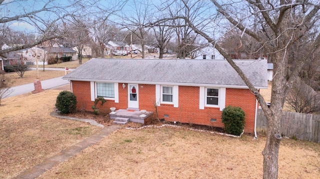 ranch-style home with a front yard