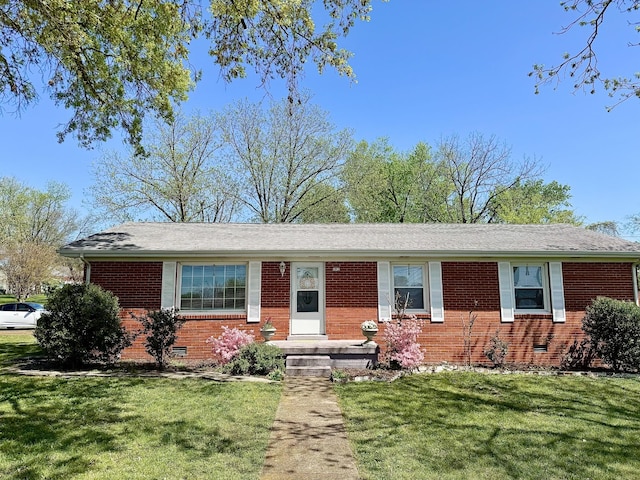 ranch-style home featuring a front yard, crawl space, and brick siding