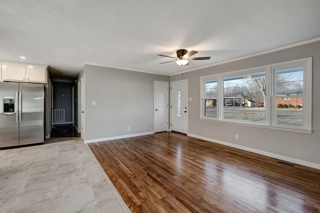 604 W 4th Ave, Hohenwald, TN 38462 - interior space with hardwood / wood-style floors, crown molding, and ceiling fan