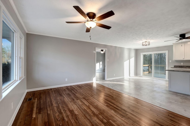 604 W 4th Ave, Hohenwald, TN 38462 - unfurnished living room with wood-type flooring, ornamental molding, a textured ceiling, and ceiling fan