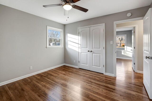 604 W 4th Ave, Hohenwald, TN 38462 - unfurnished bedroom with wood-type flooring, a closet, and ceiling fan