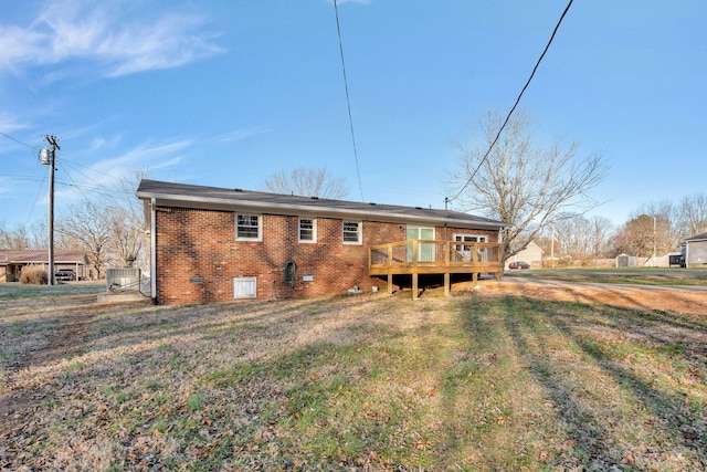604 W 4th Ave, Hohenwald, TN 38462 - back of house featuring a wooden deck and a lawn