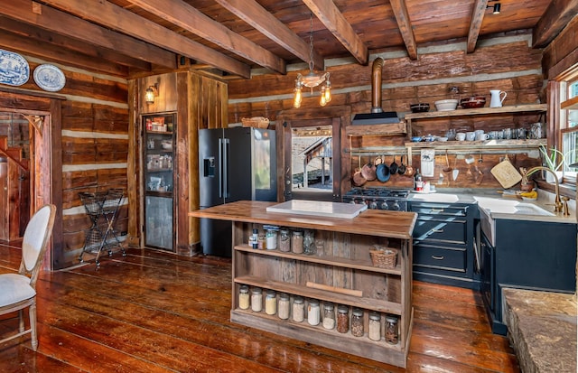 kitchen featuring wooden walls, dark hardwood / wood-style flooring, black refrigerator with ice dispenser, and wooden ceiling