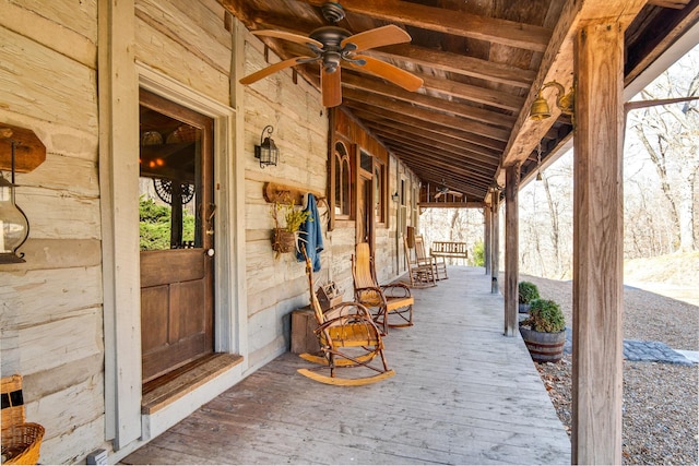 exterior space with ceiling fan and a porch