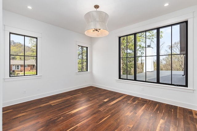 spare room featuring dark hardwood / wood-style floors