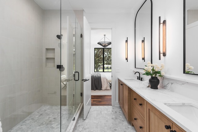 bathroom featuring vanity, an enclosed shower, and french doors