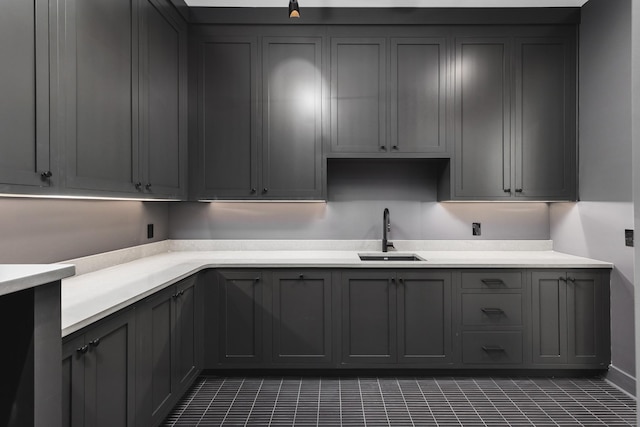 kitchen with gray cabinets and sink