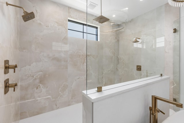 bathroom with a tile shower