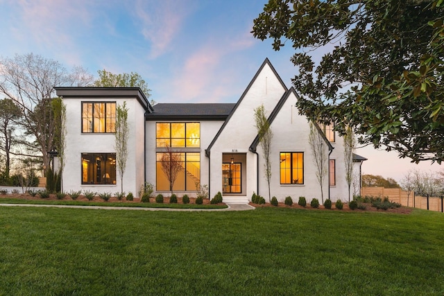 view of front of house with a yard