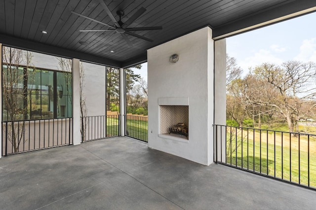 unfurnished sunroom with plenty of natural light and wooden ceiling