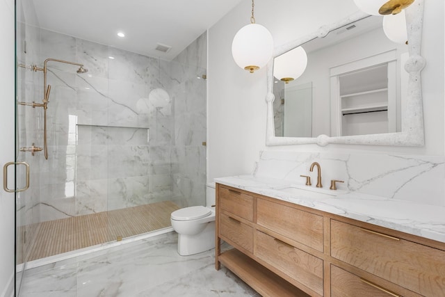 bathroom with tasteful backsplash, vanity, toilet, and a shower with door