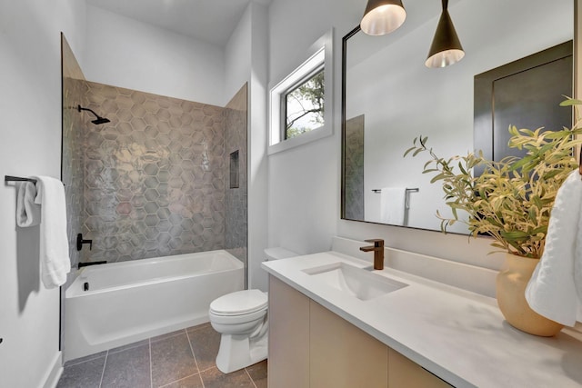 full bathroom with tiled shower / bath, vanity, toilet, and tile patterned floors