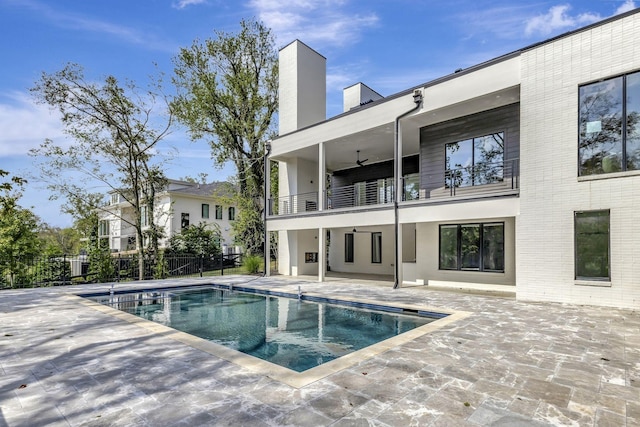 view of pool with ceiling fan and a patio area