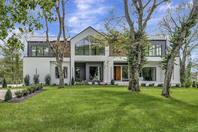 modern home featuring a front lawn